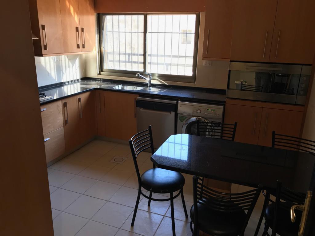 A fourth-floor apartment with a roof, available for rent or sale in Abdoun. - Property Image 20